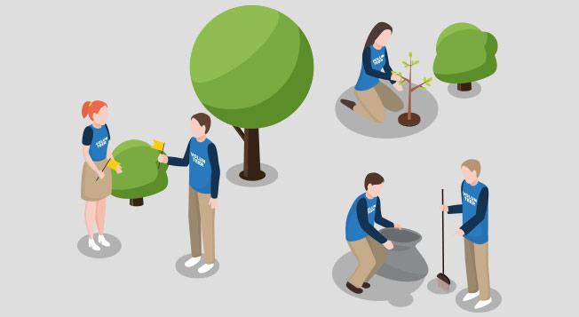 A team wearing blue shirts volunteering planting trees and cleaning garbage.