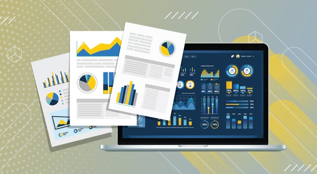 Reports and graph data on top of a laptop computer