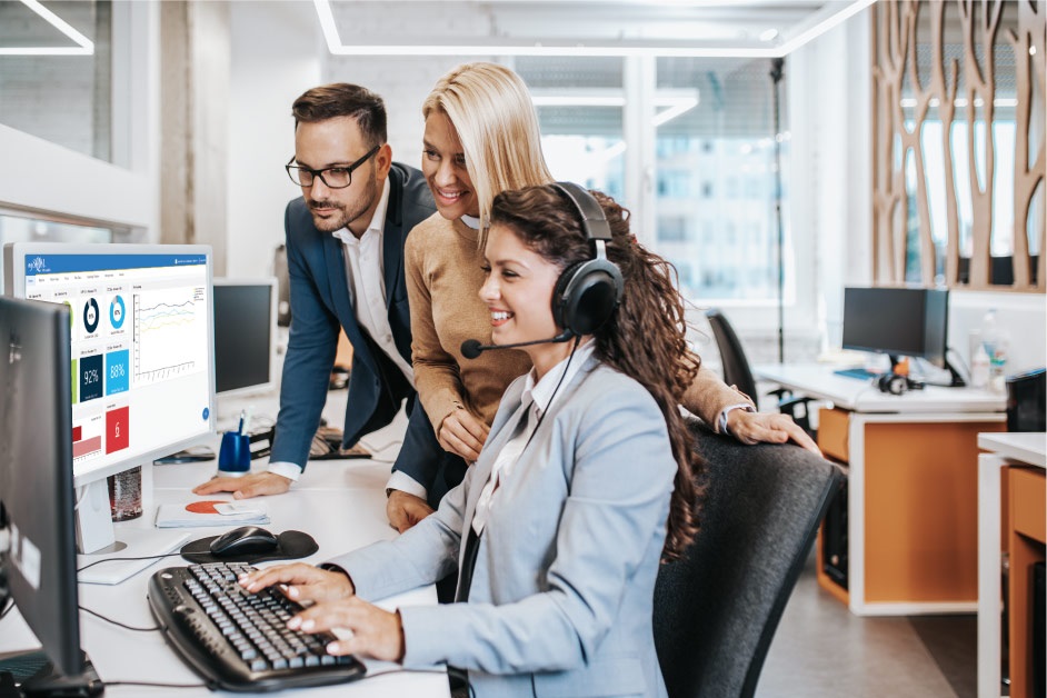 a group of customer service agents using mySQM customer service QA software on a computer