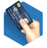 A hand holding a credit card